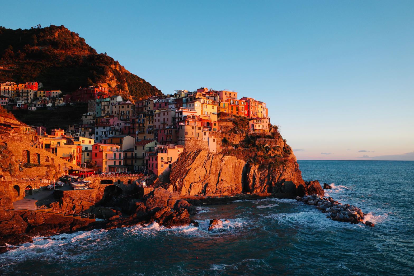 Manarola at sunset above the Ligurian Sea.