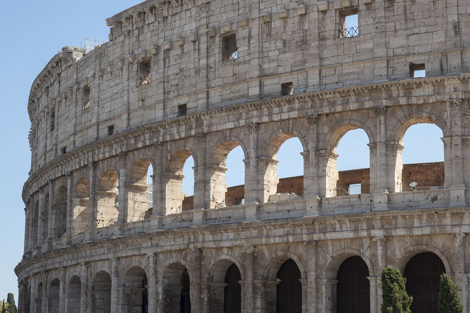 The Colosseum in Rome, the arched outer wall in daylight.